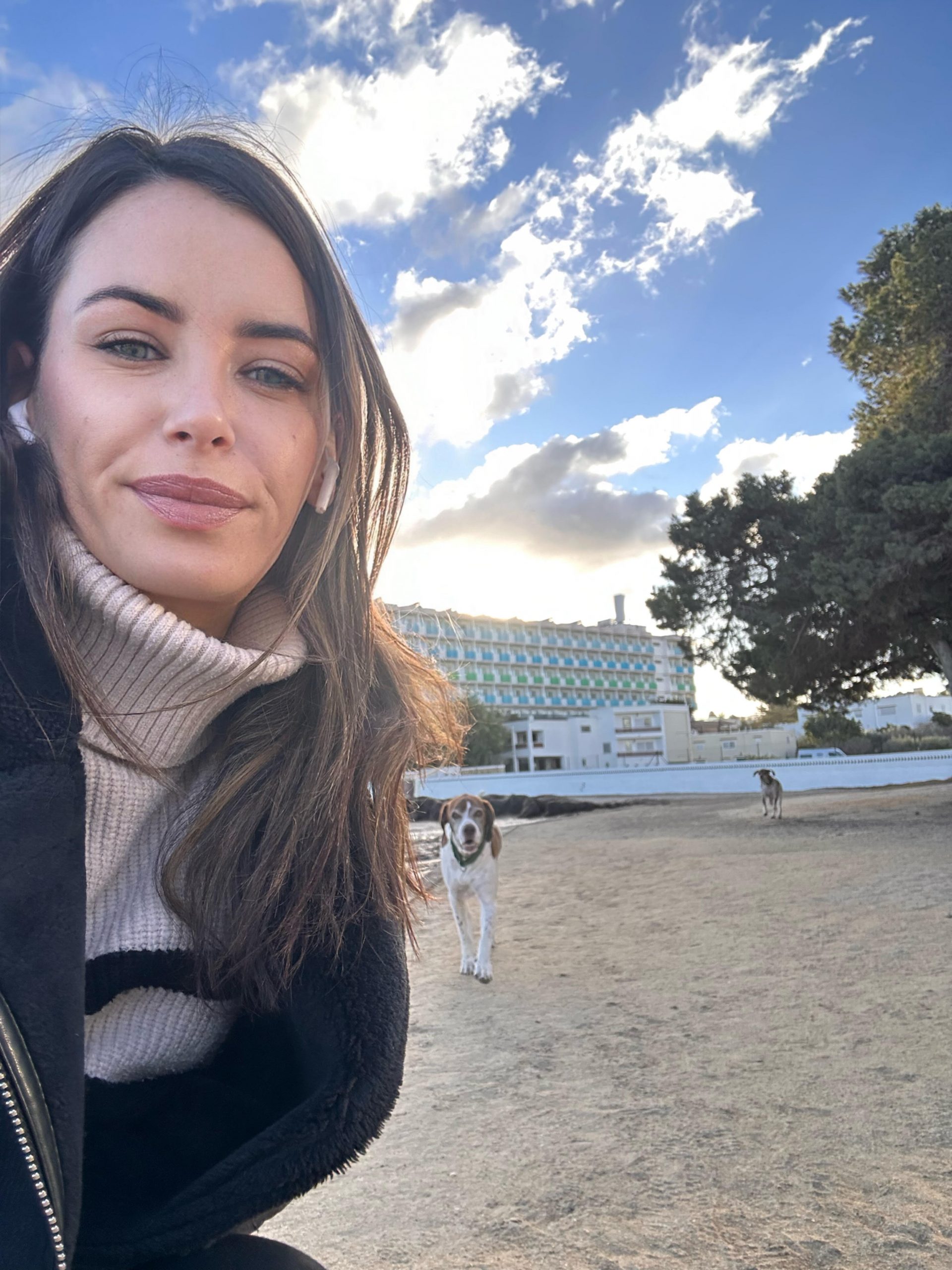 Author on beach with dogs 