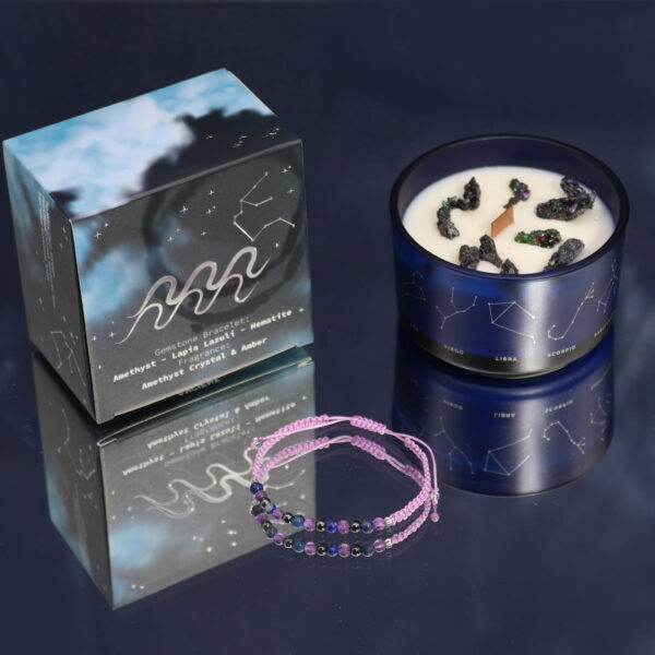 Midnight blue soy wax zodiac candle with silver-embossed constellation design, wooden crackle wick, Peruvian pyrite decoration, and gemstone bracelet for [Zodiac Sign]. Presented in a luxury silver-embossed gift box."